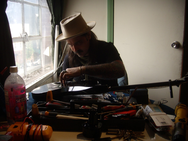 JJ works on one of the many guitars in The Damned Things' arsenal