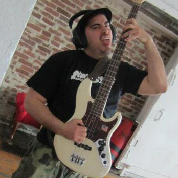 Bass player Andrew Rosenfeld from Midnight High holding bass