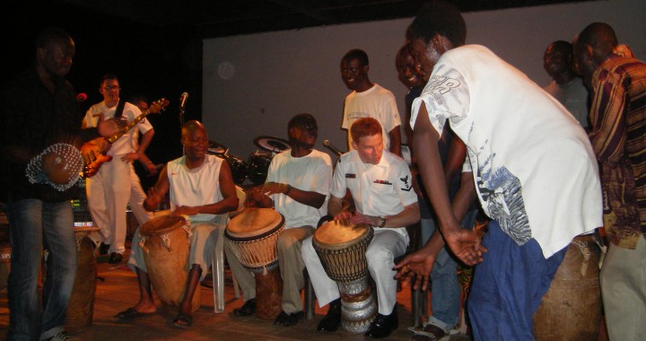 MU2 Christopher Cancelliere performing with a Ghanaian drummers