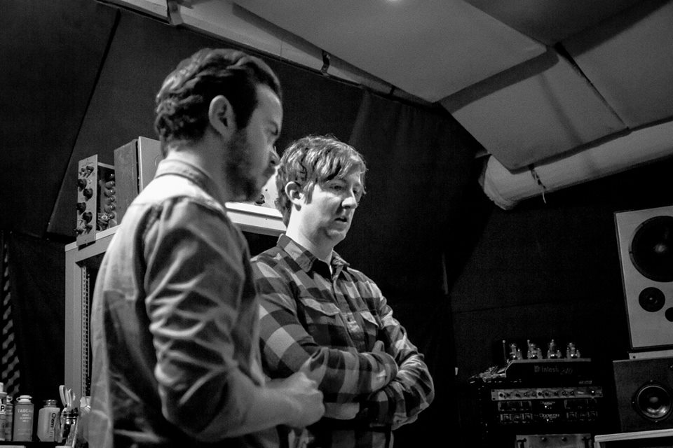 Tim and Charlie listening back